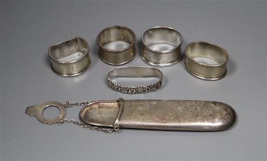 A silver spectacle case, four silver napkin rings and a Norwegian 830S napkin ring.
